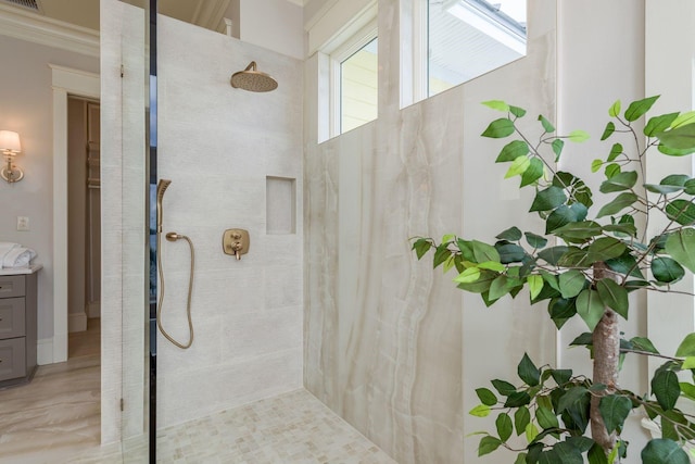 442 Midway Is, Clearwater Beach, FL 33767 - full bath with tiled shower, vanity, and crown molding