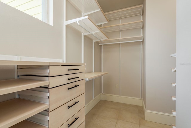 442 Midway Is, Clearwater Beach, FL 33767 - walk in closet featuring light tile patterned floors