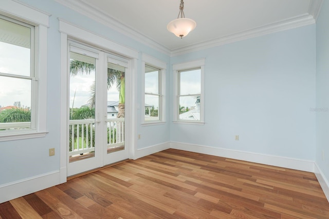 442 Midway Is, Clearwater Beach, FL 33767 - empty room with light wood finished floors and ornamental molding