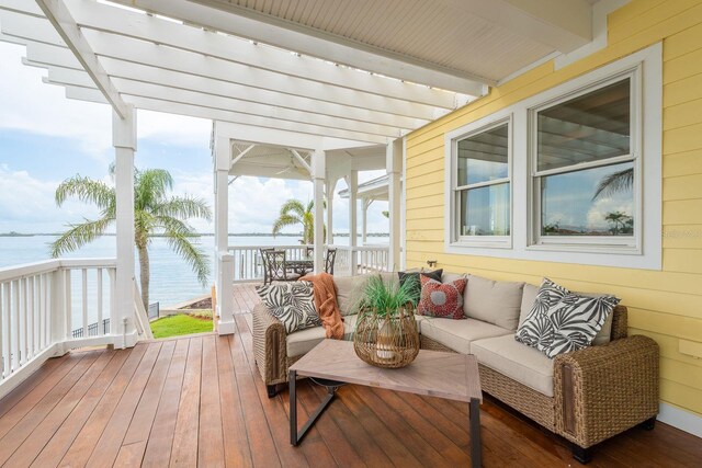 442 Midway Is, Clearwater Beach, FL 33767 - deck featuring a water view, a pergola, and outdoor lounge area