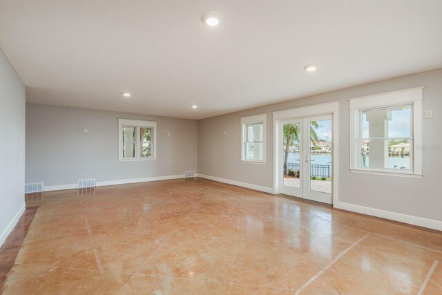 442 Midway Is, Clearwater Beach, FL 33767 - spare room featuring recessed lighting and light tile patterned floors