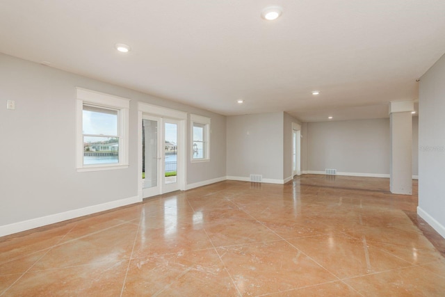 442 Midway Is, Clearwater Beach, FL 33767 - unfurnished room with baseboards and recessed lighting