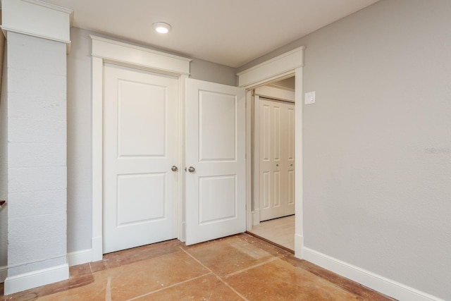 442 Midway Is, Clearwater Beach, FL 33767 - unfurnished bedroom featuring concrete floors and a closet