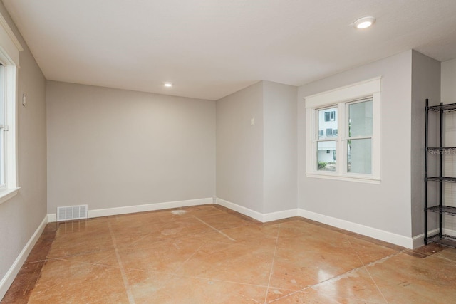 442 Midway Is, Clearwater Beach, FL 33767 - unfurnished room featuring plenty of natural light, recessed lighting, and light tile patterned flooring