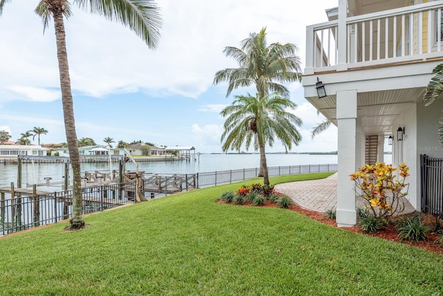 442 Midway Is, Clearwater Beach, FL 33767 - view of yard featuring boat lift, a water view, a dock, and a balcony