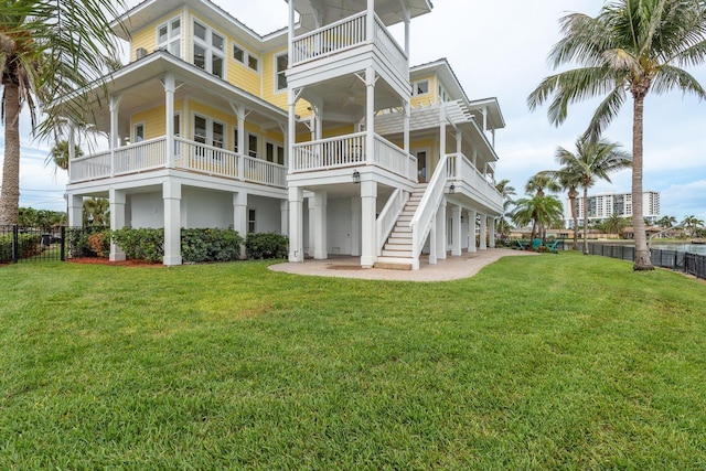 442 Midway Is, Clearwater Beach, FL 33767 - back of house featuring a balcony and a patio area