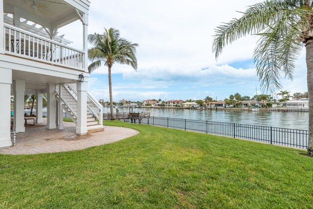 442 Midway Is, Clearwater Beach, FL 33767 - view of yard featuring a water view, stairs, and a patio