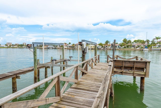 442 Midway Is, Clearwater Beach, FL 33767 - dock featuring a water view and boat lift