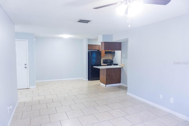 220 Berry Tree Pl Unit 220, Brandon, FL 33510 - unfurnished living room featuring ceiling fan and a textured ceiling