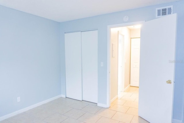 220 Berry Tree Pl Unit 220, Brandon, FL 33510 - unfurnished bedroom featuring light tile patterned floors and a closet