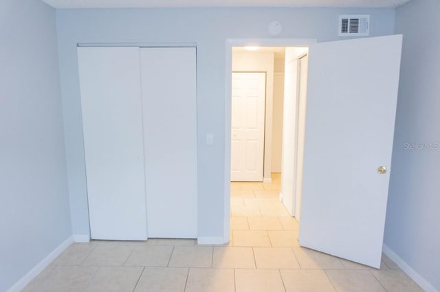 220 Berry Tree Pl Unit 220, Brandon, FL 33510 - unfurnished bedroom with light tile patterned flooring and a closet
