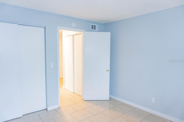 220 Berry Tree Pl Unit 220, Brandon, FL 33510 - unfurnished bedroom featuring a closet and light tile patterned floors