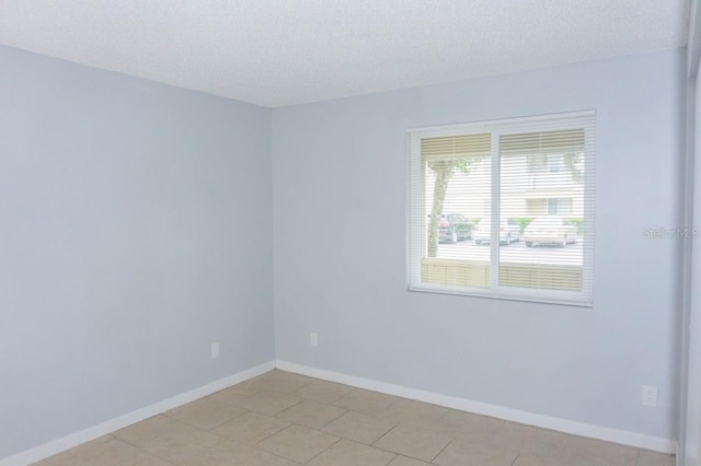 220 Berry Tree Pl Unit 220, Brandon, FL 33510 - unfurnished room featuring a textured ceiling and light tile patterned flooring