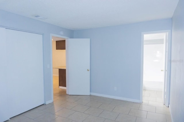 220 Berry Tree Pl Unit 220, Brandon, FL 33510 - empty room featuring light tile patterned floors and baseboards