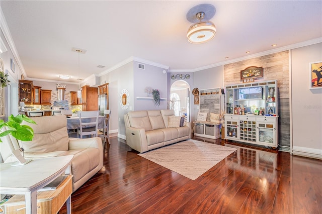 1205 Sweet Gum Dr, Brandon, FL 33511 - living area with wood finished floors, crown molding, and arched walkways