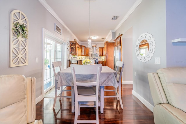 1205 Sweet Gum Dr, Brandon, FL 33511 - dining space with dark wood-style floors, healthy amount of natural light, and ornamental molding