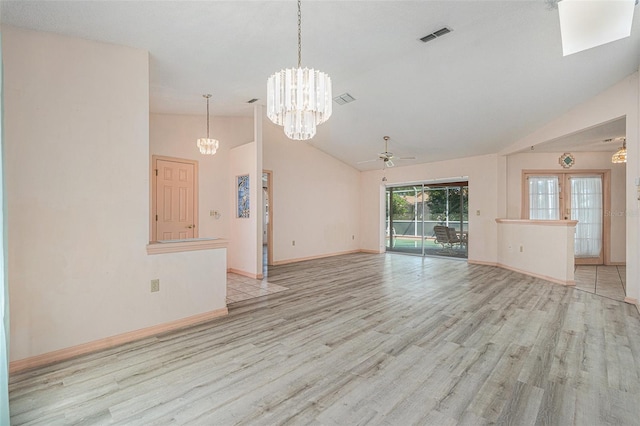 4355 Odin St, Spring Hill, FL 34608 - unfurnished living room with a chandelier, light wood-style flooring, ceiling fan, and high vaulted ceiling