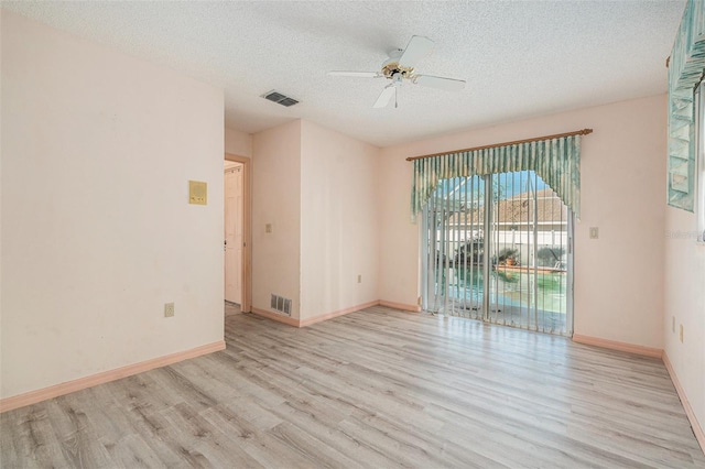 4355 Odin St, Spring Hill, FL 34608 - unfurnished room with wood finished floors, a ceiling fan, and a textured ceiling