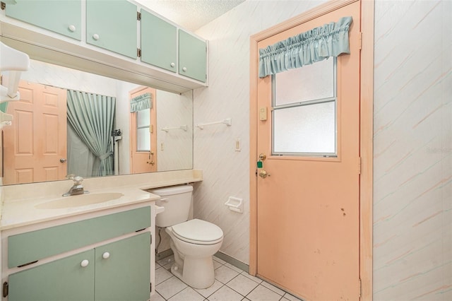 4355 Odin St, Spring Hill, FL 34608 - bathroom with tile patterned flooring, vanity, and a textured ceiling