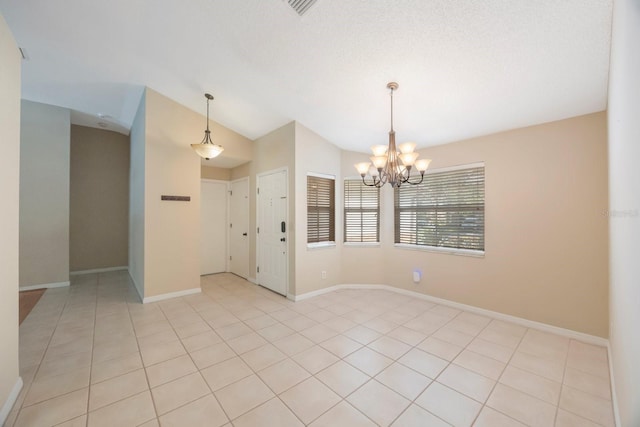 12405 Pathway Ct, Riverview, FL 33569 - unfurnished room featuring a chandelier, light tile patterned floors, and vaulted ceiling