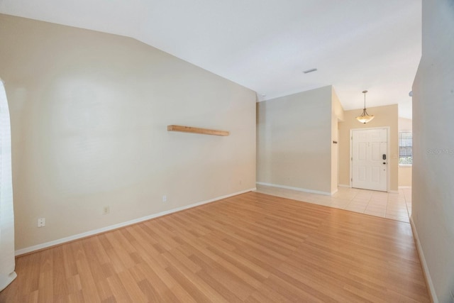 12405 Pathway Ct, Riverview, FL 33569 - spare room with vaulted ceiling and light wood-type flooring