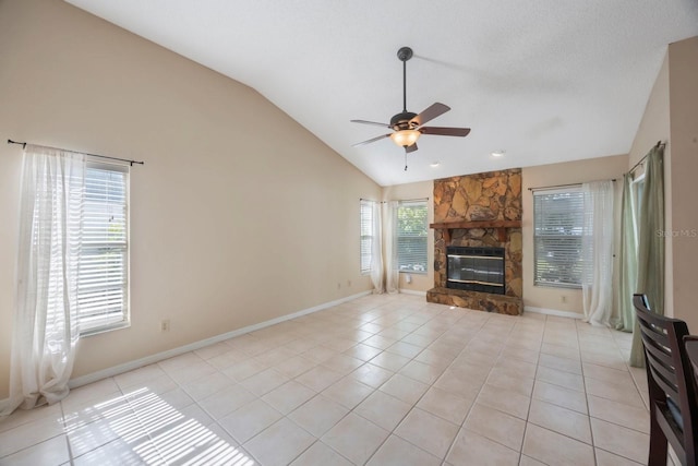12405 Pathway Ct, Riverview, FL 33569 - unfurnished living room featuring vaulted ceiling, a ceiling fan, light tile patterned flooring, and a fireplace