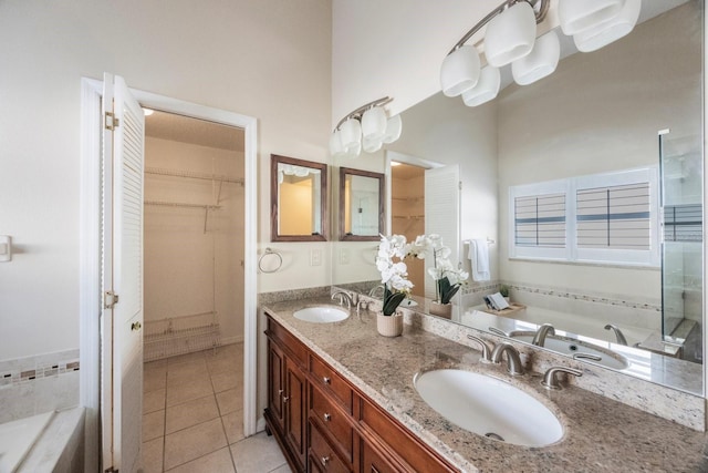 12405 Pathway Ct, Riverview, FL 33569 - full bathroom with a bath, double vanity, tile patterned floors, and a walk in closet
