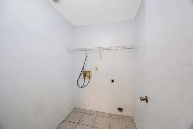 12405 Pathway Ct, Riverview, FL 33569 - laundry area with electric dryer hookup, washer hookup, and light tile patterned floors