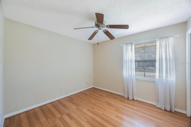 12405 Pathway Ct, Riverview, FL 33569 - unfurnished room with light wood finished floors, ceiling fan, and a textured ceiling