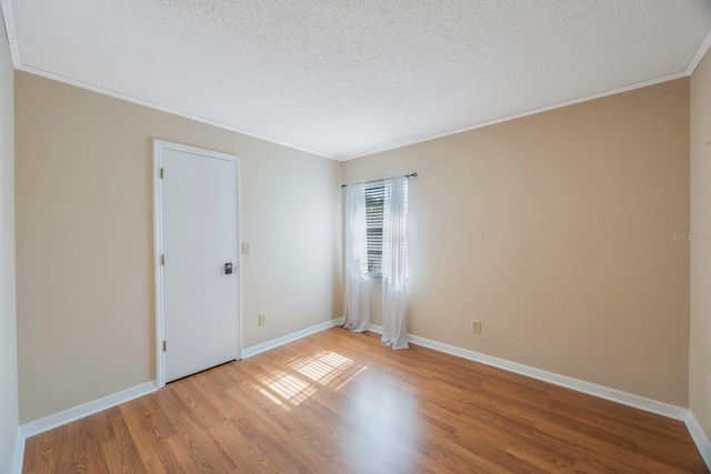 12405 Pathway Ct, Riverview, FL 33569 - unfurnished room with a textured ceiling, crown molding, and wood finished floors