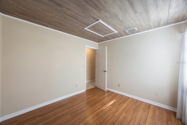 12405 Pathway Ct, Riverview, FL 33569 - unfurnished room featuring crown molding, wood finished floors, wood ceiling, and attic access
