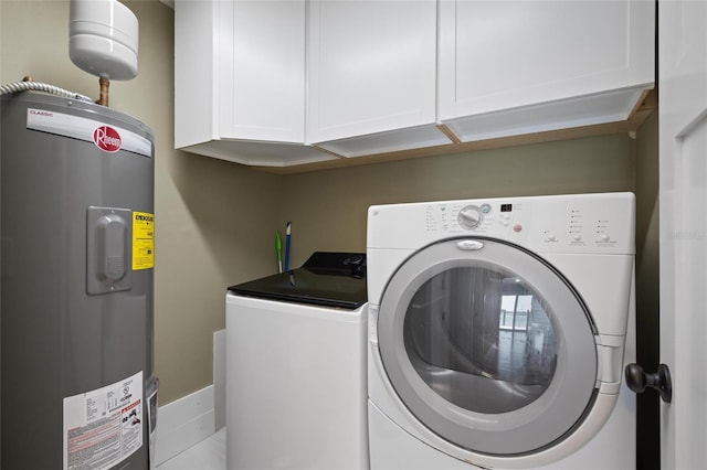 17 Freshwater Dr, Palm Harbor, FL 34684 - laundry area with electric water heater, washer and clothes dryer, and cabinet space