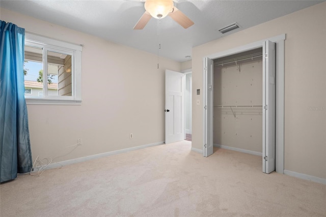 17 Freshwater Dr, Palm Harbor, FL 34684 - unfurnished bedroom featuring carpet, a closet, and ceiling fan