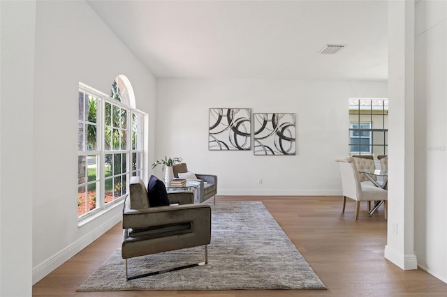 1800 Loch Haven Ct, Trinity, FL 34655 - sitting room featuring healthy amount of natural light and wood finished floors