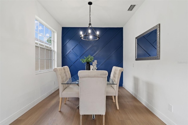 1800 Loch Haven Ct, Trinity, FL 34655 - dining room with wood finished floors and a chandelier