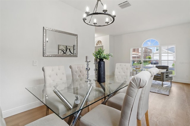 1800 Loch Haven Ct, Trinity, FL 34655 - dining room featuring a chandelier and wood finished floors