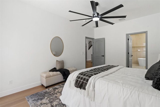 1800 Loch Haven Ct, Trinity, FL 34655 - bedroom featuring wood finished floors, ensuite bath, and ceiling fan