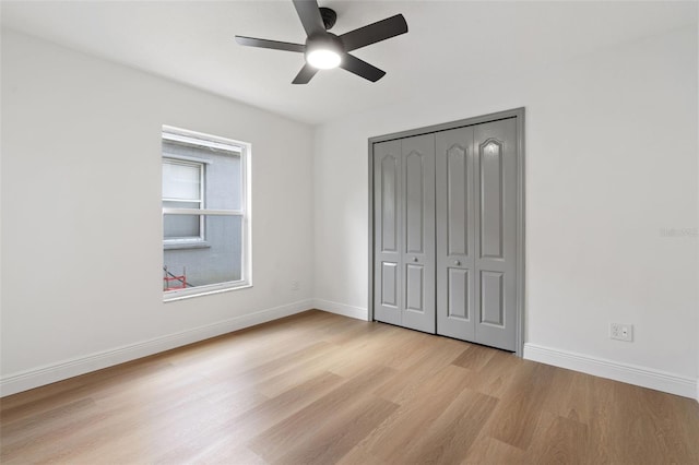 1800 Loch Haven Ct, Trinity, FL 34655 - unfurnished bedroom featuring light wood-style floors, a closet, and ceiling fan