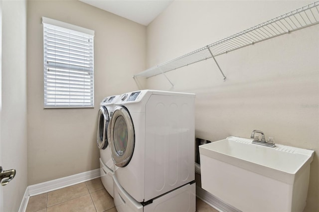 4544 Vermillion Sky Dr, Wesley Chapel, FL 33544 - washroom with separate washer and dryer and light tile patterned floors