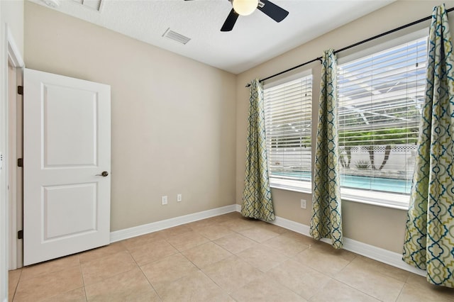 4544 Vermillion Sky Dr, Wesley Chapel, FL 33544 - empty room featuring a ceiling fan and light tile patterned floors