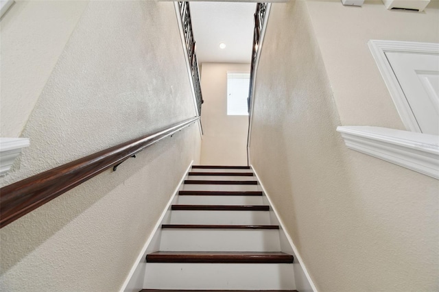4544 Vermillion Sky Dr, Wesley Chapel, FL 33544 - staircase featuring a textured wall