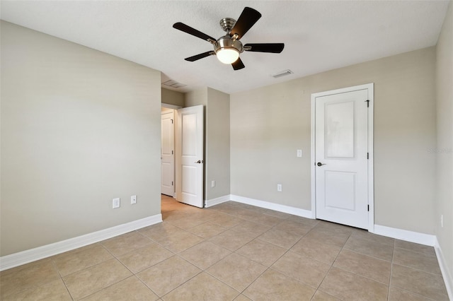 4544 Vermillion Sky Dr, Wesley Chapel, FL 33544 - unfurnished bedroom featuring light tile patterned floors and ceiling fan