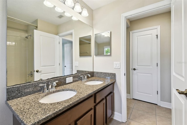 4544 Vermillion Sky Dr, Wesley Chapel, FL 33544 - bathroom with double vanity, tile patterned floors, and a shower
