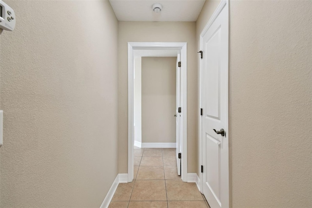 4544 Vermillion Sky Dr, Wesley Chapel, FL 33544 - hall with light tile patterned flooring and baseboards