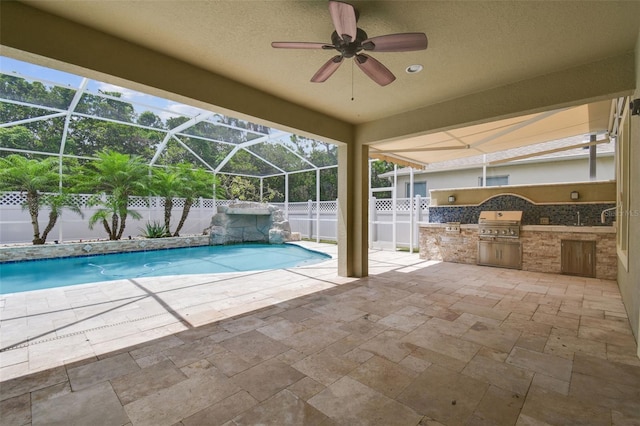 4544 Vermillion Sky Dr, Wesley Chapel, FL 33544 - view of pool with an outdoor kitchen, a fenced backyard, a patio, and a lanai