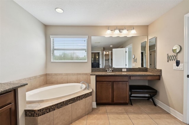 4544 Vermillion Sky Dr, Wesley Chapel, FL 33544 - full bathroom featuring vanity, a garden tub, tile patterned flooring, and a stall shower
