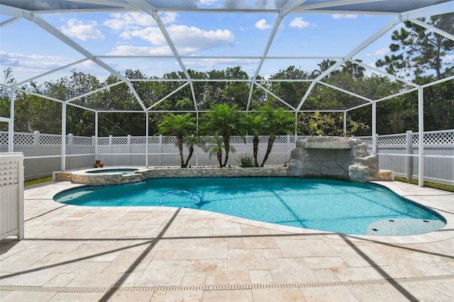 4544 Vermillion Sky Dr, Wesley Chapel, FL 33544 - view of swimming pool featuring a fenced backyard, a patio, a pool with connected hot tub, and glass enclosure