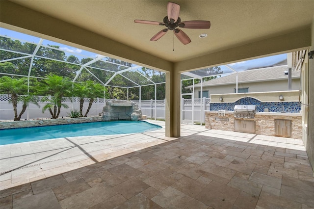 4544 Vermillion Sky Dr, Wesley Chapel, FL 33544 - view of pool with an outdoor kitchen, a patio area, a lanai, a fenced backyard, and ceiling fan