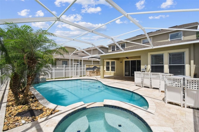 4544 Vermillion Sky Dr, Wesley Chapel, FL 33544 - view of swimming pool with a patio area, a pool with connected hot tub, ceiling fan, glass enclosure, and an outdoor kitchen