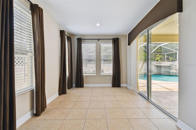 4544 Vermillion Sky Dr, Wesley Chapel, FL 33544 - spare room with baseboards and light tile patterned floors